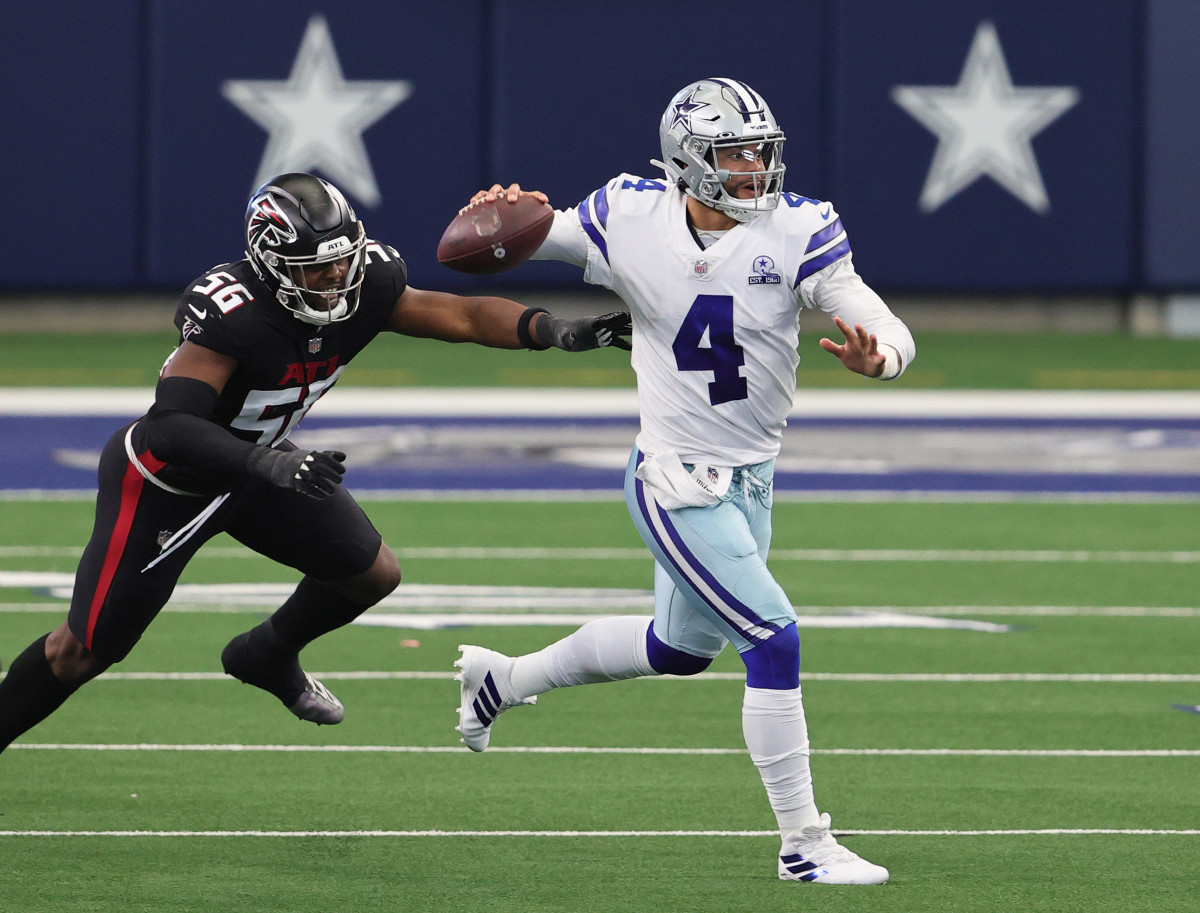 Dak Prescott evades Falcons linebacker Dante Fowler Jr. as he throws on the run. 